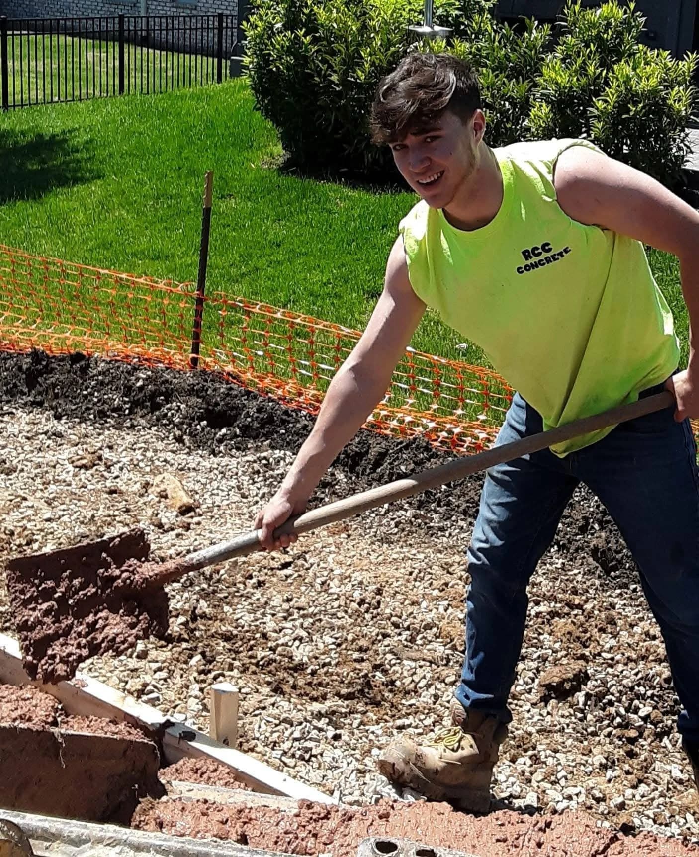 Crew member preparing a pool deck base