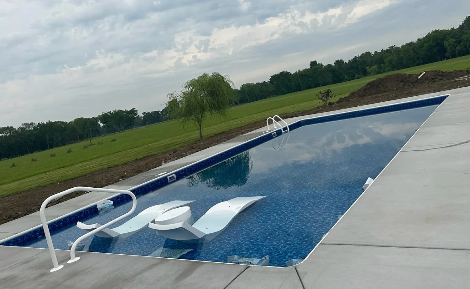 Pool with tanning ledge and in-water loungers