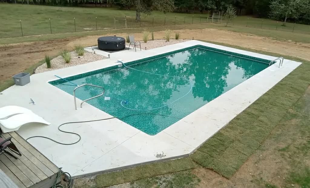 New pool with hot tub and fresh sod