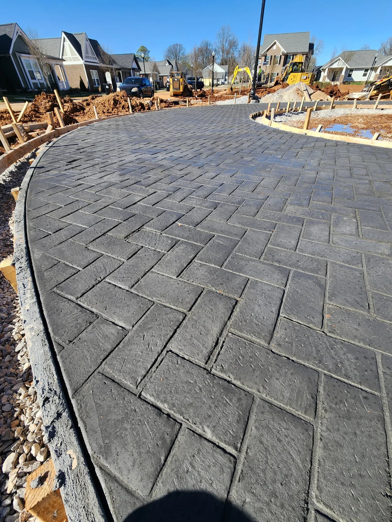 Stamped concrete driveway with herringbone pattern