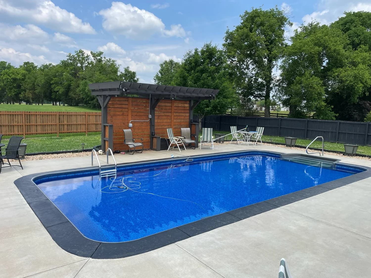 Custom inground vinyl liner pool with pergola